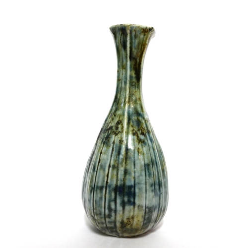 591 - MARTIN BROTHERS, BRITISH, ESTABLISHED 1873, A STONEWARE GLAZED SLENDER NECK VASE
With ribbed body, s... 