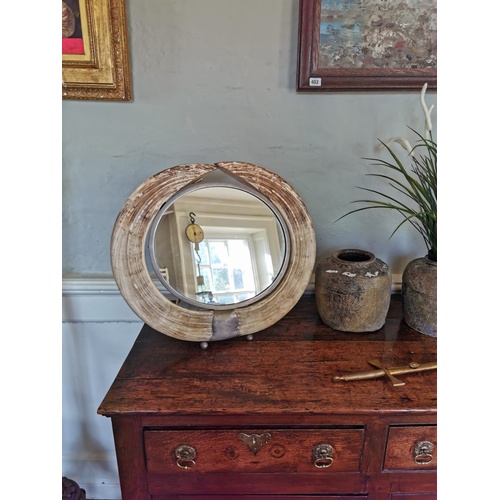 50a - AN EARLY 20TH CENTURY HIPPO TUSK CIRCULAR DRESSING TABLE MIRROR.
(diameter 52cm x 45cm)