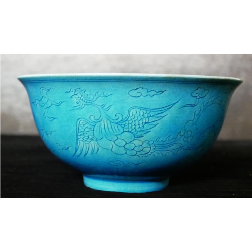 652 - A CHINESE BLUE GLAZE PORCELAIN BOWL
Hand painted underglaze decoration of phoenix birds, bearing a s... 