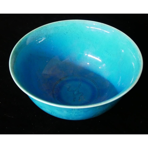 652 - A CHINESE BLUE GLAZE PORCELAIN BOWL
Hand painted underglaze decoration of phoenix birds, bearing a s... 
