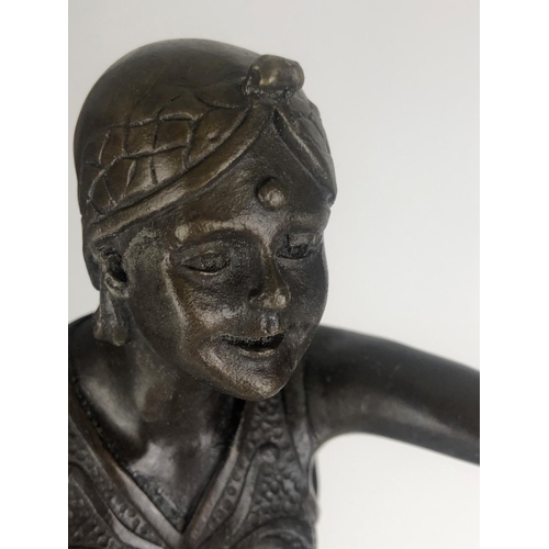 676 - AN ART DECO STYLE BRONZE STATUE OF A SEMICLAD FEMALE DANCER
On circular rouge and black marble base.... 