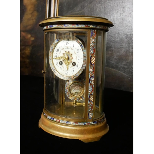 682 - LE ROY, PARIS, AN OVAL CASED BRONZE AND CHAMPLEVE MANTLE CLOCK
With four side bevelled convex glazed... 