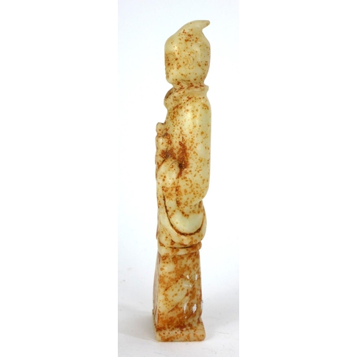 698 - A CHINESE HARDSTONE CARVINGS OF AN ELDER
Standing pose with long robes and holding a book.
(approx 1... 