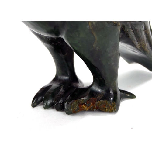 702 - A CHINESE CARVED HARDSTONE BIRD SCULPTURE
Standing pose with carved plumage.
(approx 18cm)