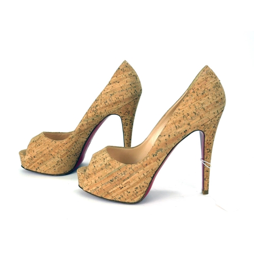 717 - CHRISTIAN LOUBOUTIN, A VINTAGE PAIR OF CORK DESIGN LEATHER HIGH HEEL LADIES' SHOES
Having red soles,... 
