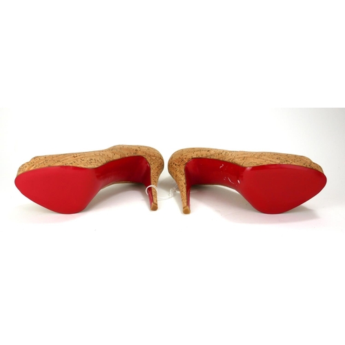 717 - CHRISTIAN LOUBOUTIN, A VINTAGE PAIR OF CORK DESIGN LEATHER HIGH HEEL LADIES' SHOES
Having red soles,... 