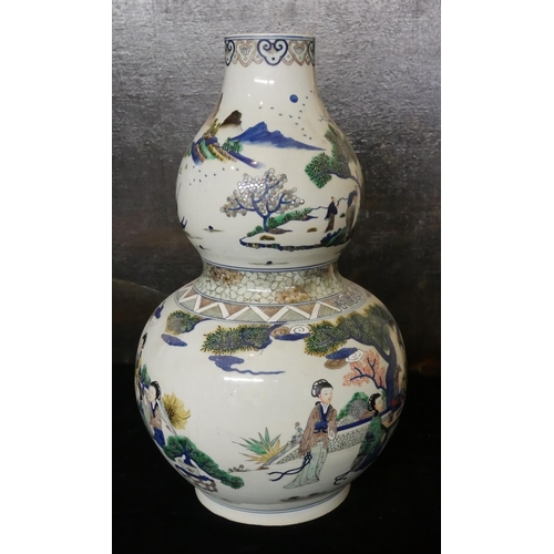 729 - A LARGE CHINESE DOUBLE GOURD VASE 
Famille verte decoration, in the form of maidens in garden settin... 