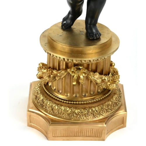 740 - A LARGE PAIR OF GILT AND PATINATED BRONZE SIX SCONCE CANDELABRA IN THE FORM OF PUTTI
Holding foliage... 