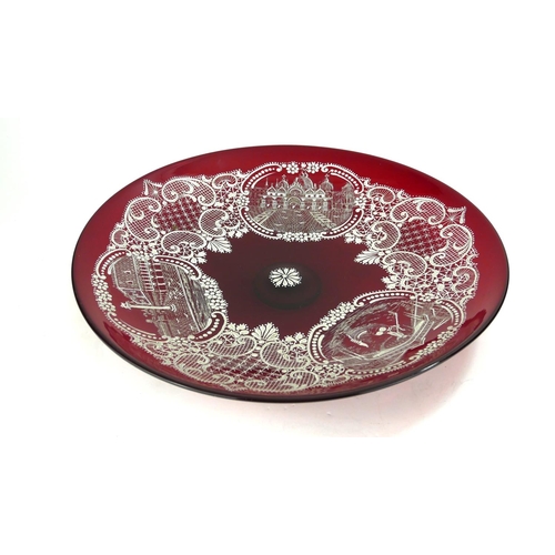 755 - A LARGE 20TH CENTURY VENETIAN RUBY GLASS CHARGER DISH
Hand painted with three landscape cartouches w... 