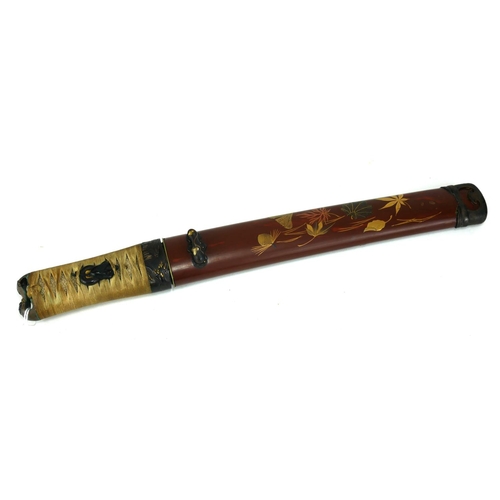 766 - A JAPANESE TANTO DAGGER
Having a shark skin handle set with gilt bronze fuchi and mounts, the dark r... 