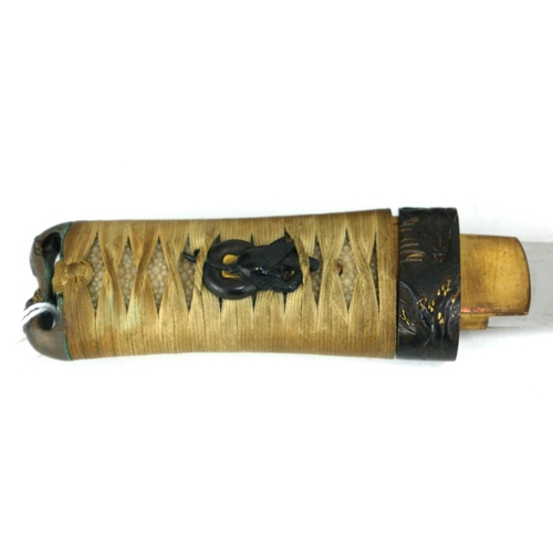 766 - A JAPANESE TANTO DAGGER
Having a shark skin handle set with gilt bronze fuchi and mounts, the dark r... 