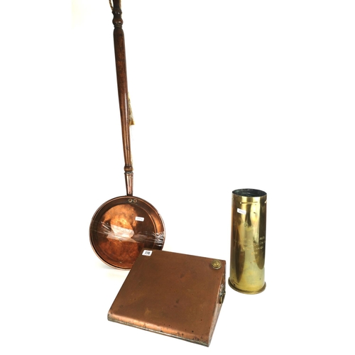 778 - A 19TH CENTURY COPPER BED WARMING PAN
Along with a copper foot warmer, a brass shell case, engraved ... 