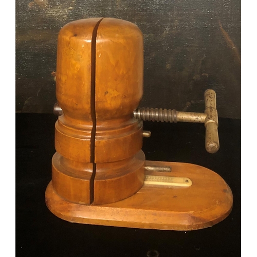 783 - A VICTORIAN/EDWARDIAN TREEN SHOP’S HAT STRETCHER
With iron tooling.