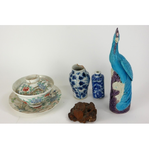 798 - A CHINESE TURQUOISE AND MANGANESE GLAZED PORCELAIN FIGURE OF A HOHO BIRD
Perched on a pierced organi... 