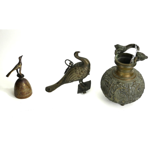 802 - A PERSIAN BRONZE CARAFE
Having a snake form swing handle with chased decoration of exotic birds and ... 