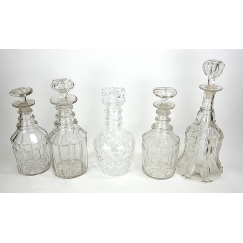 816 - A COLLECTION OF FIVE 19TH CENTURY AND LATER CUT GLASS DECANTERS
Comprising of one bell form, two mal... 