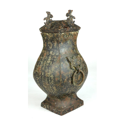242 - AN ARCHAIC FORM BRONZE CHINESE BALUSTER VASE AND COVER 
Engraved with script.
(h 29cm)