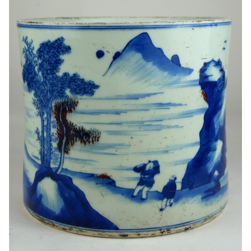 243 - A LARGE CHINESE BLUE AND WHITE BRUSH POT 
Decorated with figures and fisherman in a landscape, beari... 