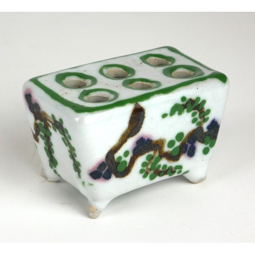 244 - A RARE AND UNUSUAL CHINESE PORCELAIN RECTANGULAR BRUSH POT
With six holes and hand painted decoratio... 