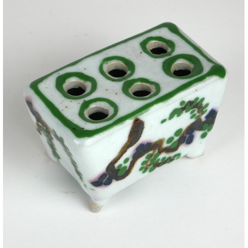 244 - A RARE AND UNUSUAL CHINESE PORCELAIN RECTANGULAR BRUSH POT
With six holes and hand painted decoratio... 