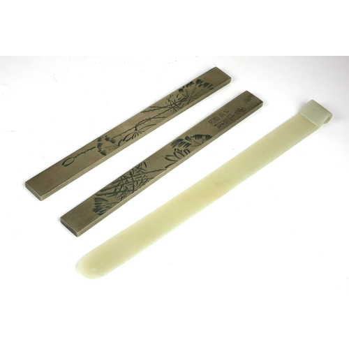 246 - A CHINESE JADE SCEPTRE
Having a scrolled design to one end, together with two Chinese white metal sc... 