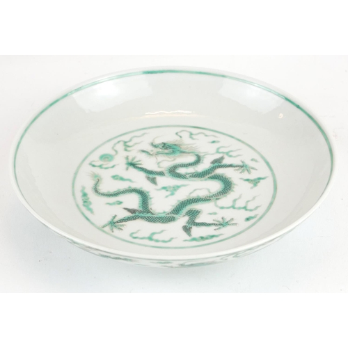 248 - A CHINESE FAMILLE VERTE DRAGON BOWL
Having a five toe dragon chasing a flaming pearl, bearing a red ... 