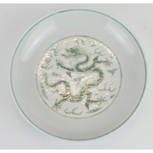 248 - A CHINESE FAMILLE VERTE DRAGON BOWL
Having a five toe dragon chasing a flaming pearl, bearing a red ... 
