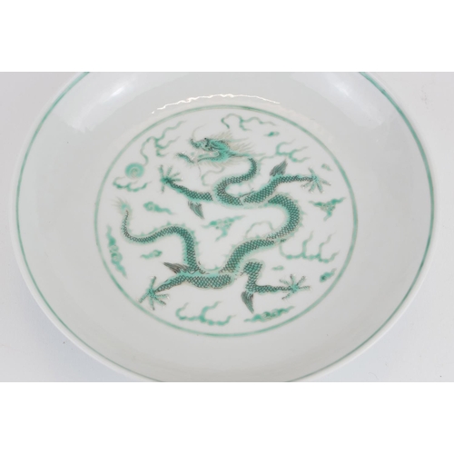 248 - A CHINESE FAMILLE VERTE DRAGON BOWL
Having a five toe dragon chasing a flaming pearl, bearing a red ... 