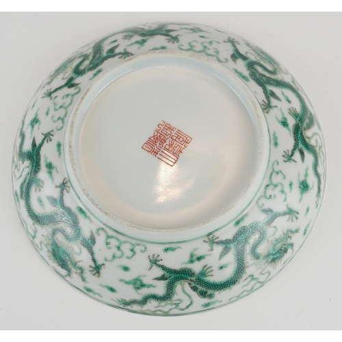 248 - A CHINESE FAMILLE VERTE DRAGON BOWL
Having a five toe dragon chasing a flaming pearl, bearing a red ... 