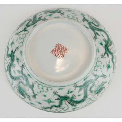 248 - A CHINESE FAMILLE VERTE DRAGON BOWL
Having a five toe dragon chasing a flaming pearl, bearing a red ... 