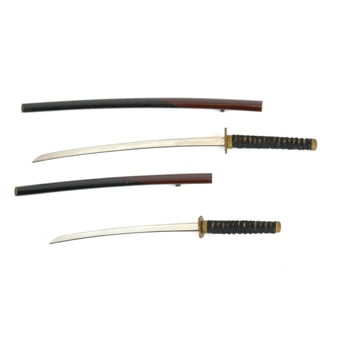 249 - A PAIR OF JAPANESE MINIATURE SAMURAI SWORDS
Having shagreen handles and black lacquer scabbards, in ... 