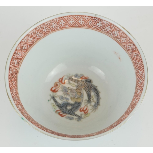 253 - A JAPANESE BLUE GLAZE PORCELAIN 'DRAGON' CUP
Having green enamel decoration of dragons chasing a fla... 