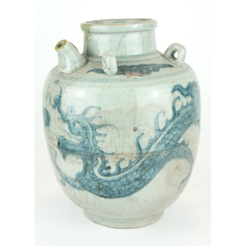 254 - A CHINESE PROVINCIAL MING PERIOD RICE WINE JUG
Decorated with a four toe dragon on a pale blue groun... 