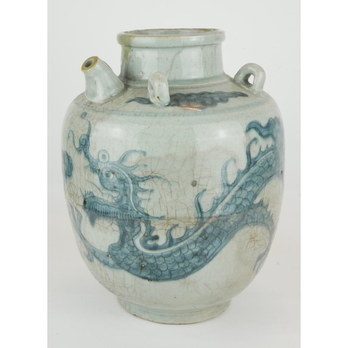 254 - A CHINESE PROVINCIAL MING PERIOD RICE WINE JUG
Decorated with a four toe dragon on a pale blue groun... 