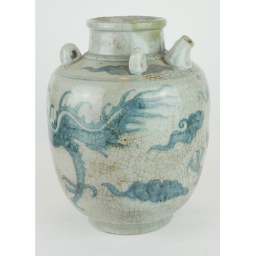 254 - A CHINESE PROVINCIAL MING PERIOD RICE WINE JUG
Decorated with a four toe dragon on a pale blue groun... 