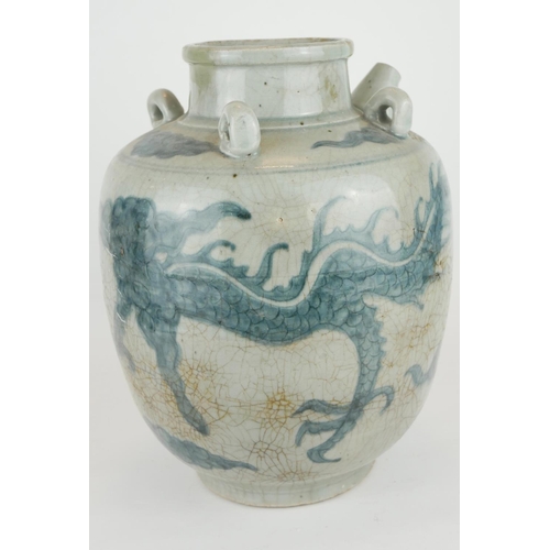 254 - A CHINESE PROVINCIAL MING PERIOD RICE WINE JUG
Decorated with a four toe dragon on a pale blue groun... 