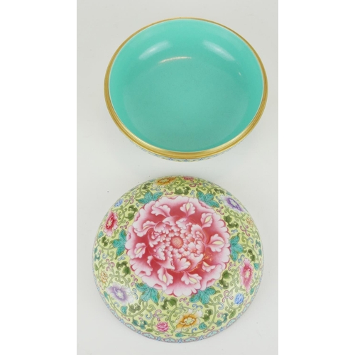 257 - A CHINESE YELLOW GLAZED FAMILLE ROSE PORCELAIN SPHERICAL BOWL AND COVER
With large pink flower to ce... 