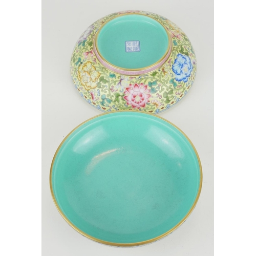 257 - A CHINESE YELLOW GLAZED FAMILLE ROSE PORCELAIN SPHERICAL BOWL AND COVER
With large pink flower to ce... 
