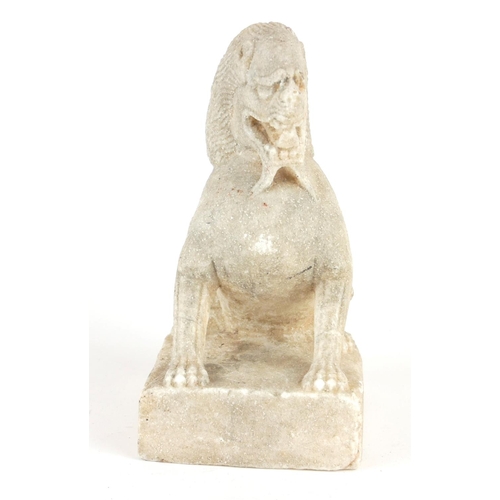 258 - A CHINESE CARVED STONE TEMPLE LION
Seated pose with grotesque features, on a square plinth.
(approx ... 