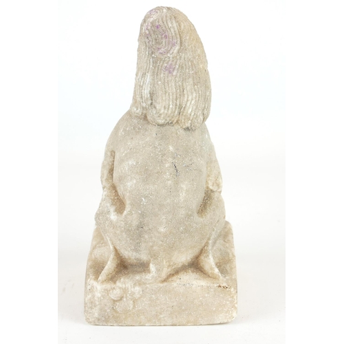 258 - A CHINESE CARVED STONE TEMPLE LION
Seated pose with grotesque features, on a square plinth.
(approx ... 