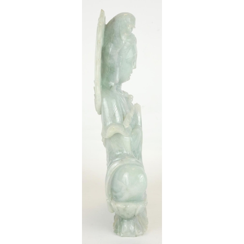259 - A LARGE CHINESE CARVED PALE GREEN JADE FIGURE OF QUAN YIN
Seated pose, on a double lotus base.
(appr... 