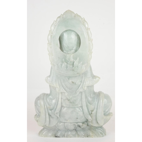 259 - A LARGE CHINESE CARVED PALE GREEN JADE FIGURE OF QUAN YIN
Seated pose, on a double lotus base.
(appr... 