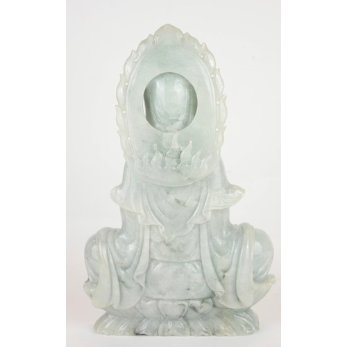 259 - A LARGE CHINESE CARVED PALE GREEN JADE FIGURE OF QUAN YIN
Seated pose, on a double lotus base.
(appr... 