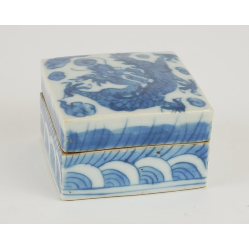 266 - A CHINESE BLUE AND WHITE PORCELAIN SQUARE TRINKET BOX
Painted decoration, dragon chasing a flaming p... 