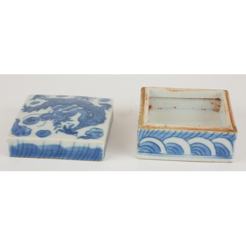 266 - A CHINESE BLUE AND WHITE PORCELAIN SQUARE TRINKET BOX
Painted decoration, dragon chasing a flaming p... 