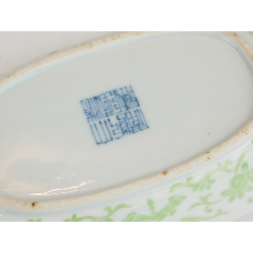 273 - A CHINESE PORCELAIN SHALLOW 'BOAT' FORM DISH
Having green lotus decoration and Qianlong blue square ... 