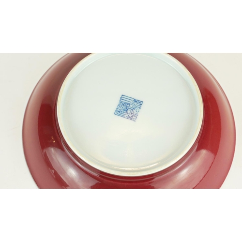 276 - A CHINESE PORCELAIN OX BLOOD GLAZE SHALLOW BOWL
With Qianlong 1736 - 1795 blue seal mark to base.
(a... 