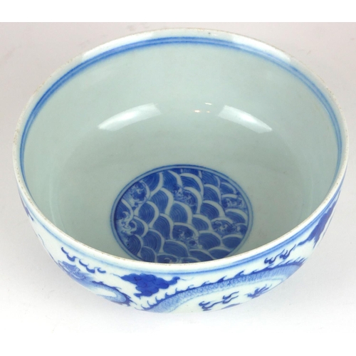 277 - A CHINESE BLUE AND WHITE PORCELAIN 'FIVE TOE DRAGON' BOWL
Decorated with dragons chasing a flaming p... 