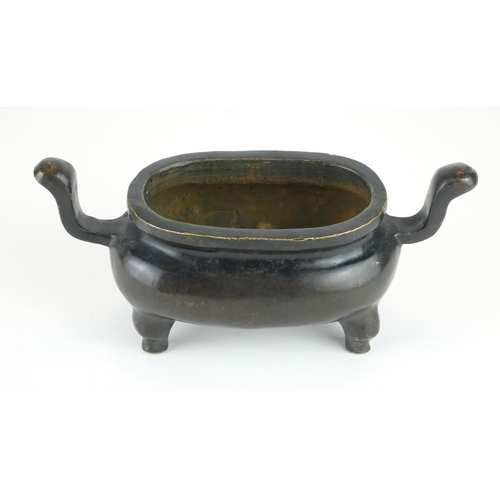 279 - A CHINESE BRONZE CENSER
Having twin handles and raised on four legs, bearing a cast Xuande 1425 - 14... 