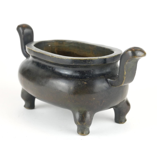 279 - A CHINESE BRONZE CENSER
Having twin handles and raised on four legs, bearing a cast Xuande 1425 - 14... 